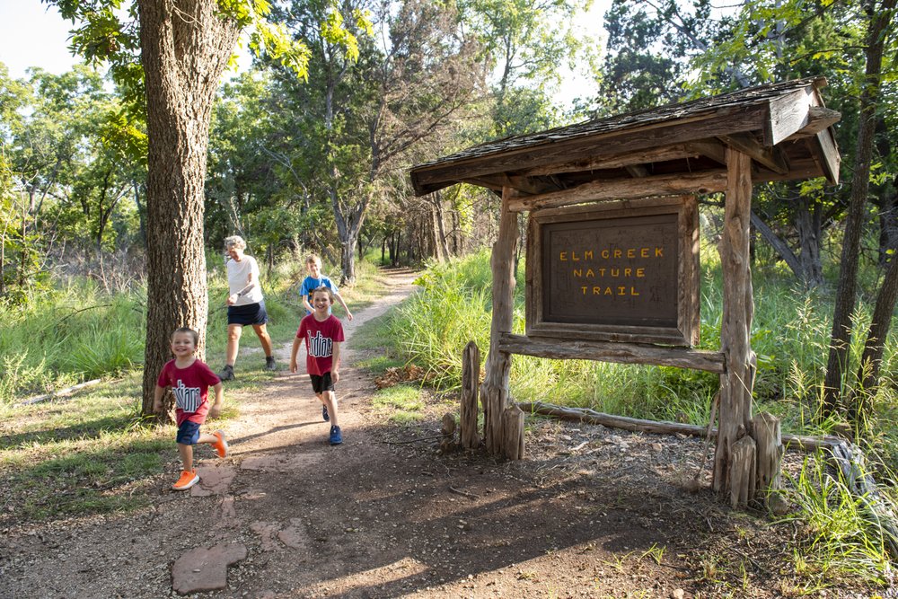 People exiting the Elm Creek Nature Trail.