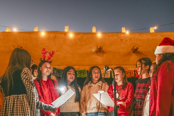A youth choir singing at the Posada at Fort Leaton State Historic Site.