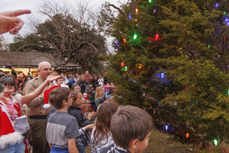 Children gathered for the Christmas tree lighting at LBJ State Park.