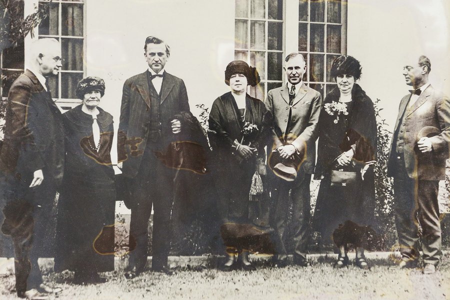 1923 texas state parks board lined up on the grass outside a building