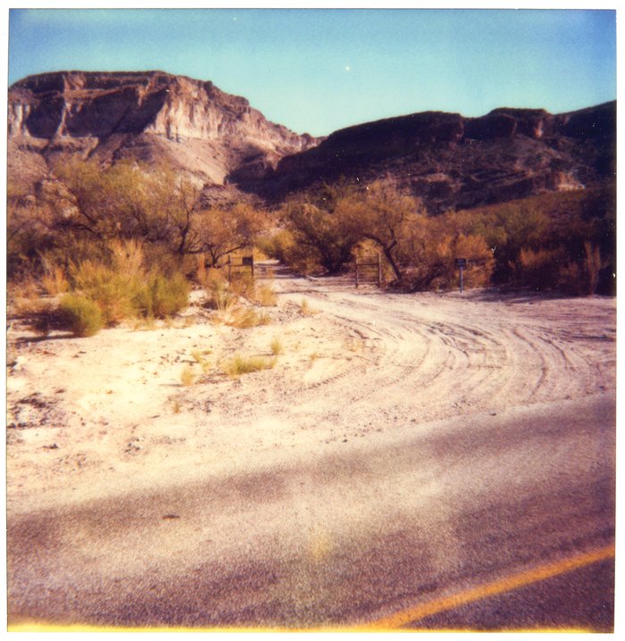 1980s Big Bend Ranch State Park Polaroid of a dirt road into the park with mountains in the background