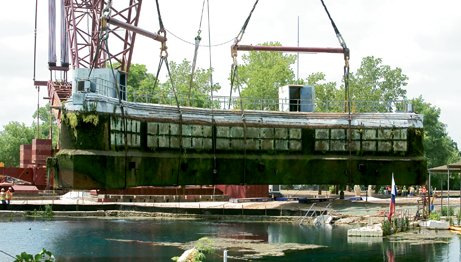 The Submarine Theater being pulled from the water of Spring Lake.