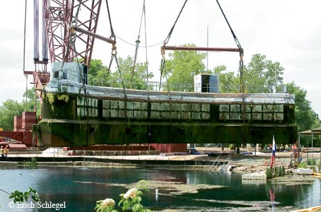The Submarine Theater being pulled from the water of Spring Lake.