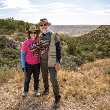 2 hikers standing together on the rim of Palo Duro Canon