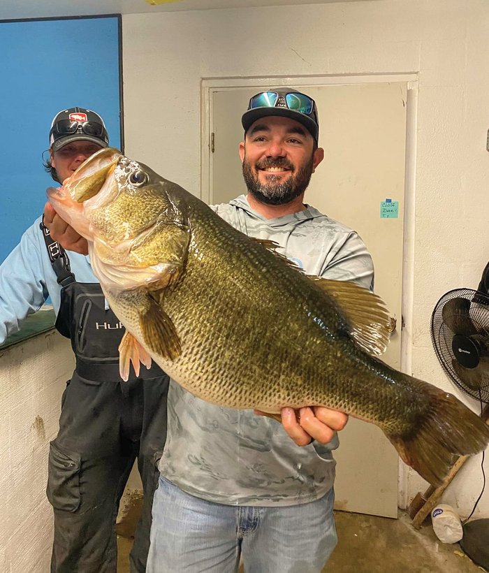 Brandon Vaughan holding bass Legacy Sharelunker #645