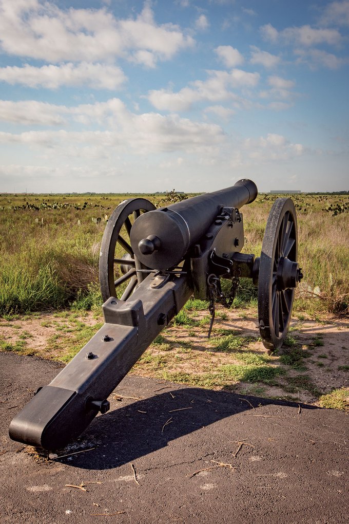 A cannon in a field.
