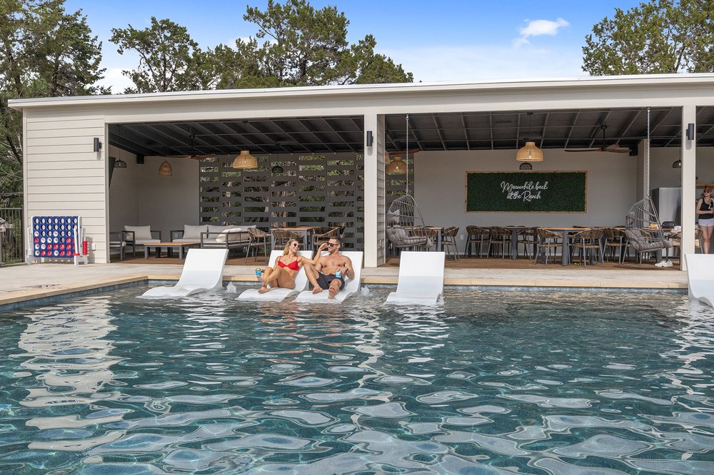 Poolside lounge chairs at The Cedars Ranch.