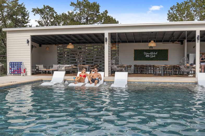 Poolside lounge chairs at The Cedars Ranch.