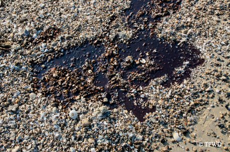 Close up of oil on beach