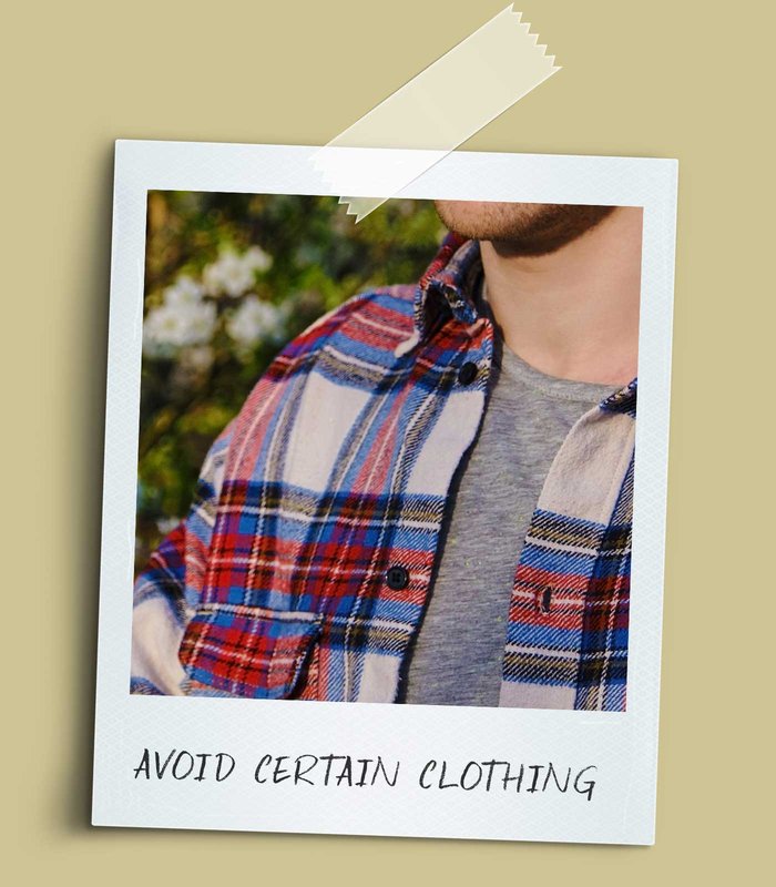 Person in a red, white and blue flannel shirt.