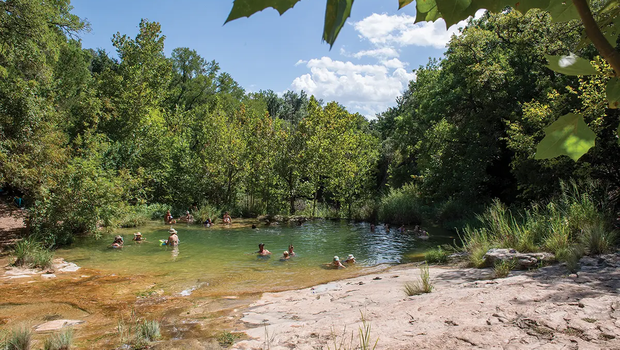 People in a watering hole at Colorado Bend State Park in Lampasas