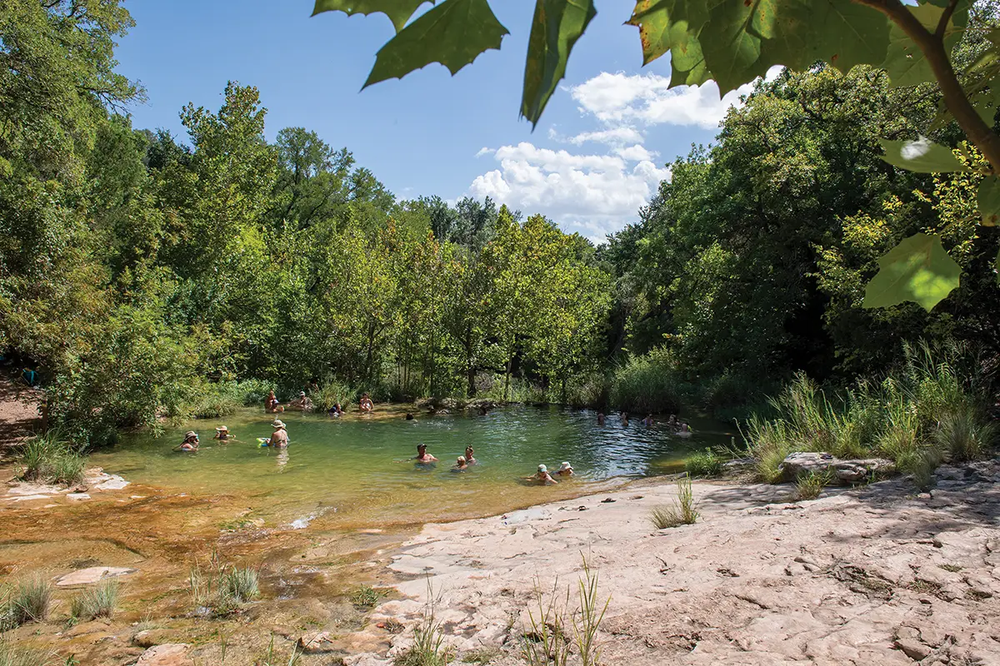 People in a watering hole at Colorado Bend State Park in Lampasas