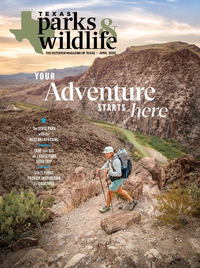 Cover April 2026 with the title Your Adventure Starts Here and a man hiking down a hill with a river below.