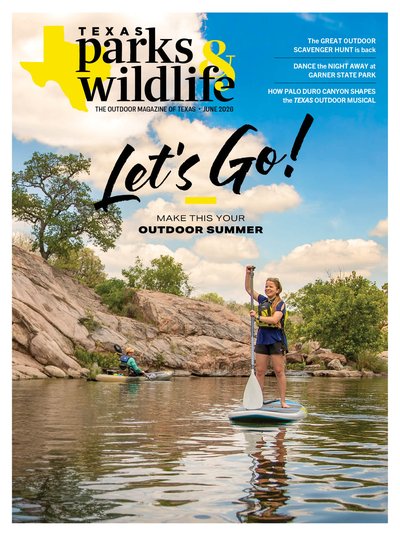 Cover_June 2026_Person on a paddleboarding in a lake with a cliff on the left side.