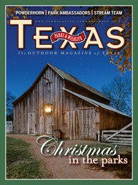 December 2014 Cover - Barn with a lantern with a darkening sky - Title: Christmas in the Parks