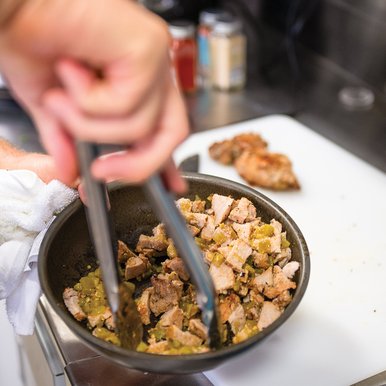 Feral hog being prepped in a bowl for tacos.