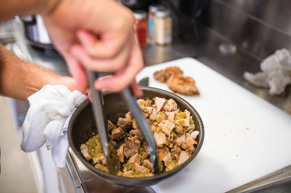 Feral hog being prepped in a bowl for tacos.