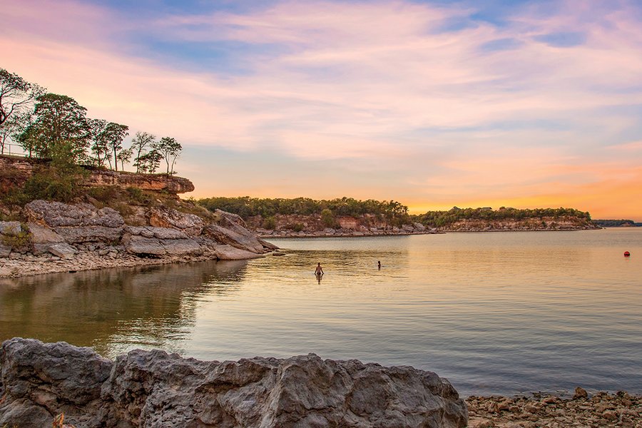 View of sunset, water and cliff faces.