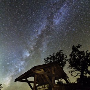 Enchanted Rock Park Sign with milky way in the night sky