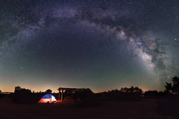 tent at an equestrian campground panorama of the night sky