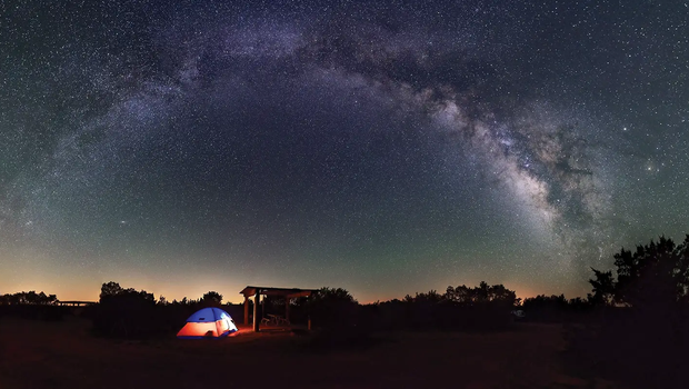 tent at an equestrian campground panorama of the night sky