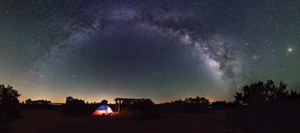 tent at an equestrian campground panorama of the night sky