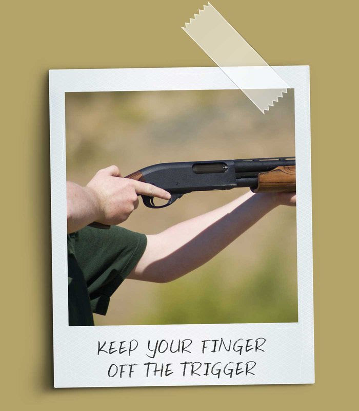 A gun with the finger off the trigger.