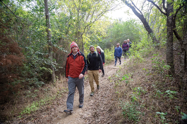 First Day Hikers walking down a Texas State park trail