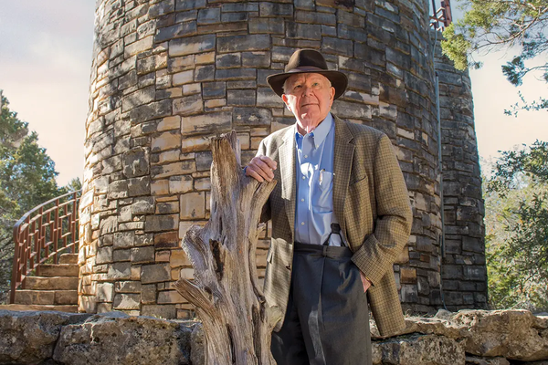 George Bristol standing in front of a stone structure at a state park