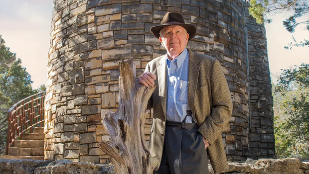 George Bristol standing in front of a stone structure at a state park