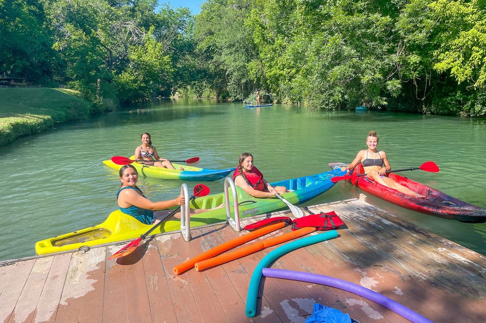 People in kayaks at Geronimo Creek Retreat