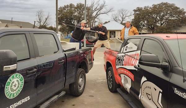 Handoff of Ivie Lunker from Distirct truck to lunker truck for faster transport to Athens