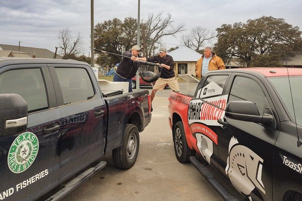 Handoff of Ivie Lunker from Distirct truck to lunker truck for faster transport to Athens