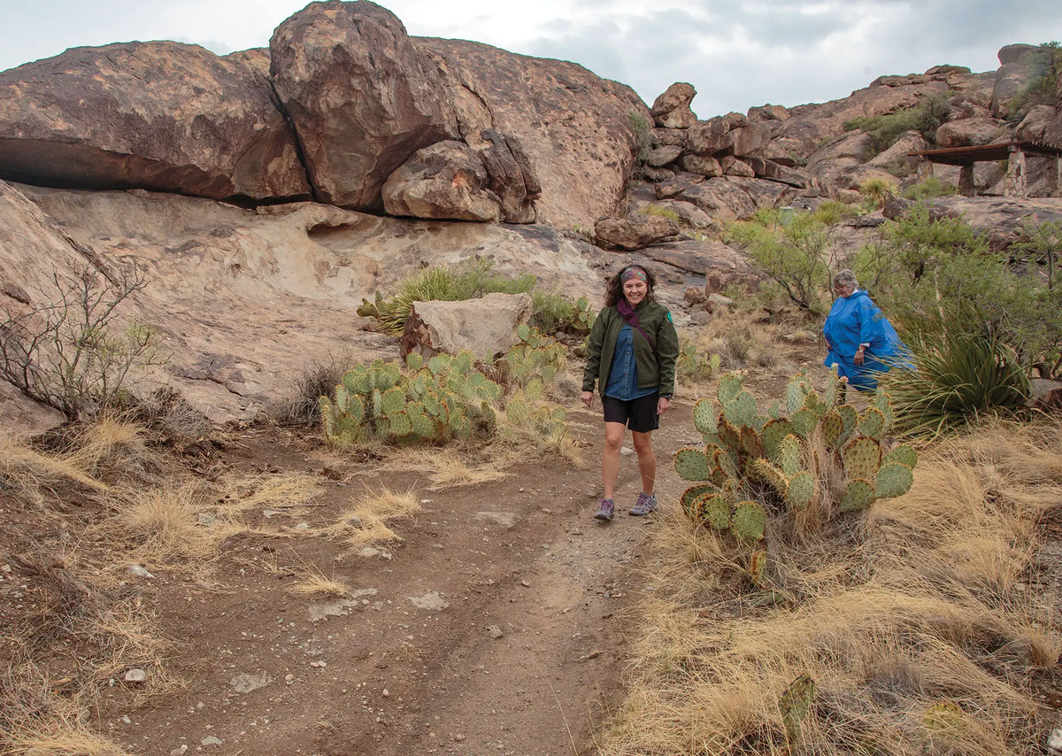 two people hiking at Hueco Tanks