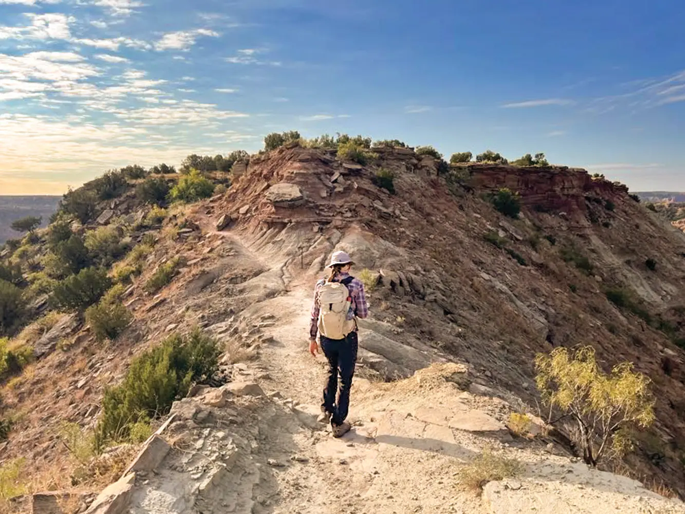 Hiker on the rim of Palo Duro Canyon
