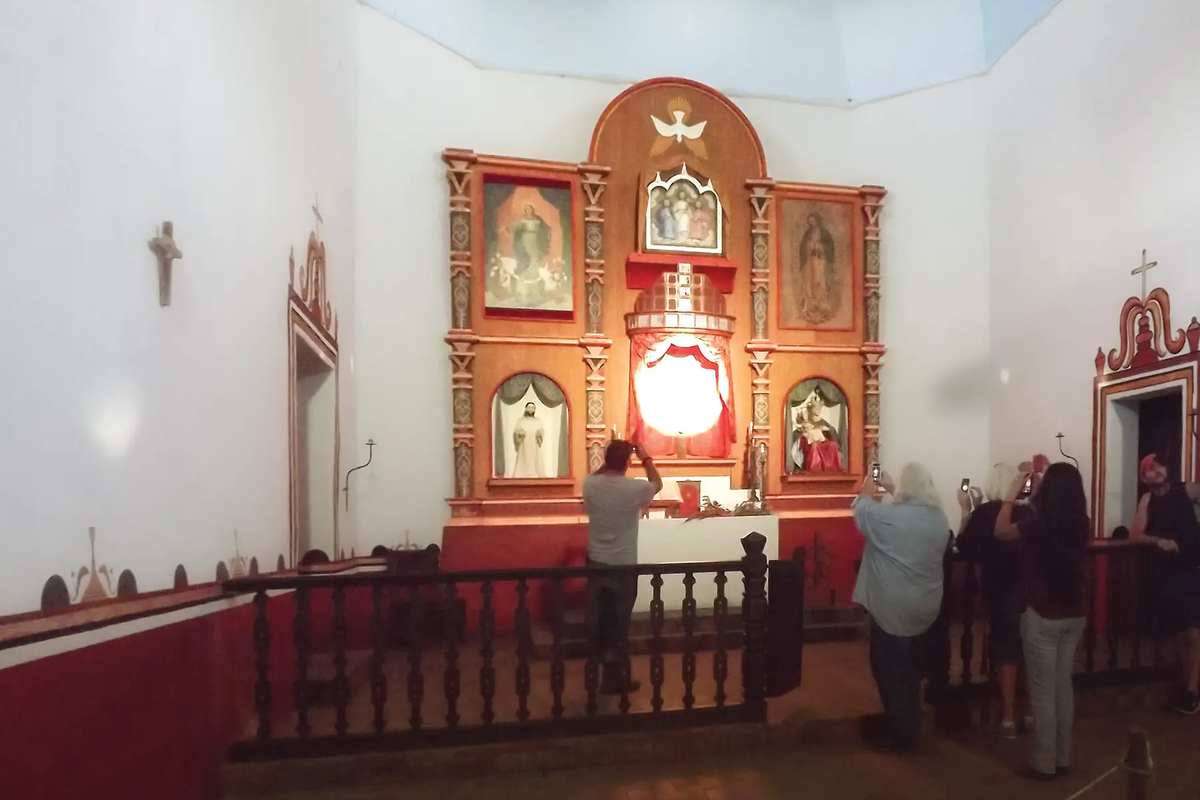 a crowd of people taking pictures during the illumination of Goliad State Park’s Mission Espíritu Santo alter