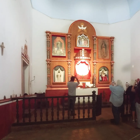 a crowd of people taking pictures during the illumination of Goliad State Park’s Mission Espíritu Santo alter