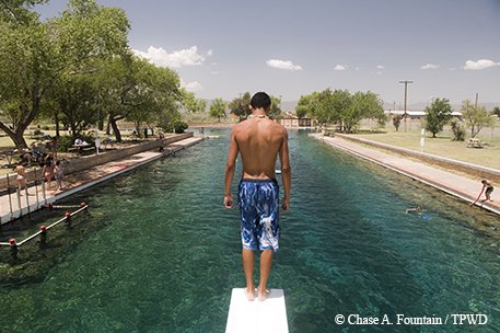 Kid on diving board at Blamorhea State Park