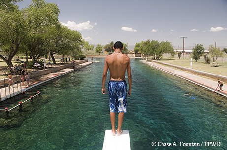 Kid on diving board at Blamorhea State Park