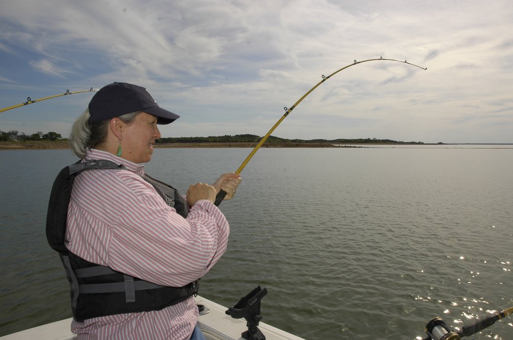 Woman fishing in Lake Buchanan for blue catfish