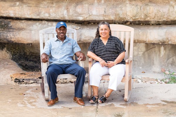 Leticia and Leon McNeil sitting in rocking chairs.