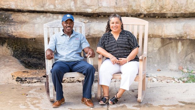 Leticia and Leon McNeil sitting in rocking chairs.
