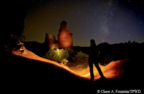 Lighthouse formation at Palo Duro lit up by a flashlight