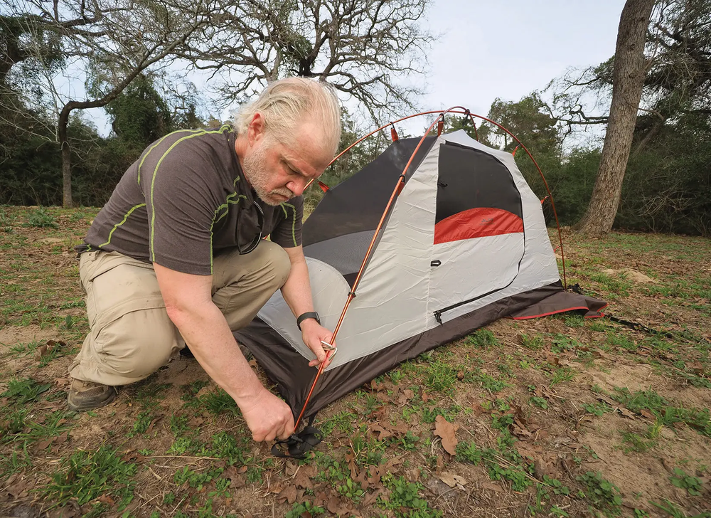Man Pitching Tent