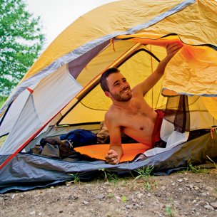 Man in tent on Northeast Texas Trail