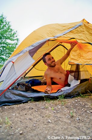 Man in tent on Northeast Texas Trail