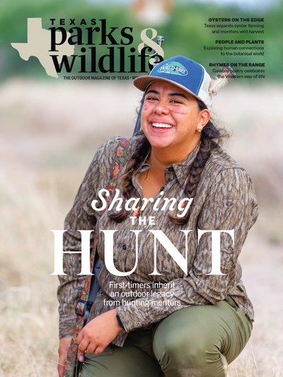 The November 2024 cover to Texas Parks & Wildlife magazine, which shows a female hunter wearing a camouflage kneeling, with streaks of red under her eyes and in the middle of her forehead