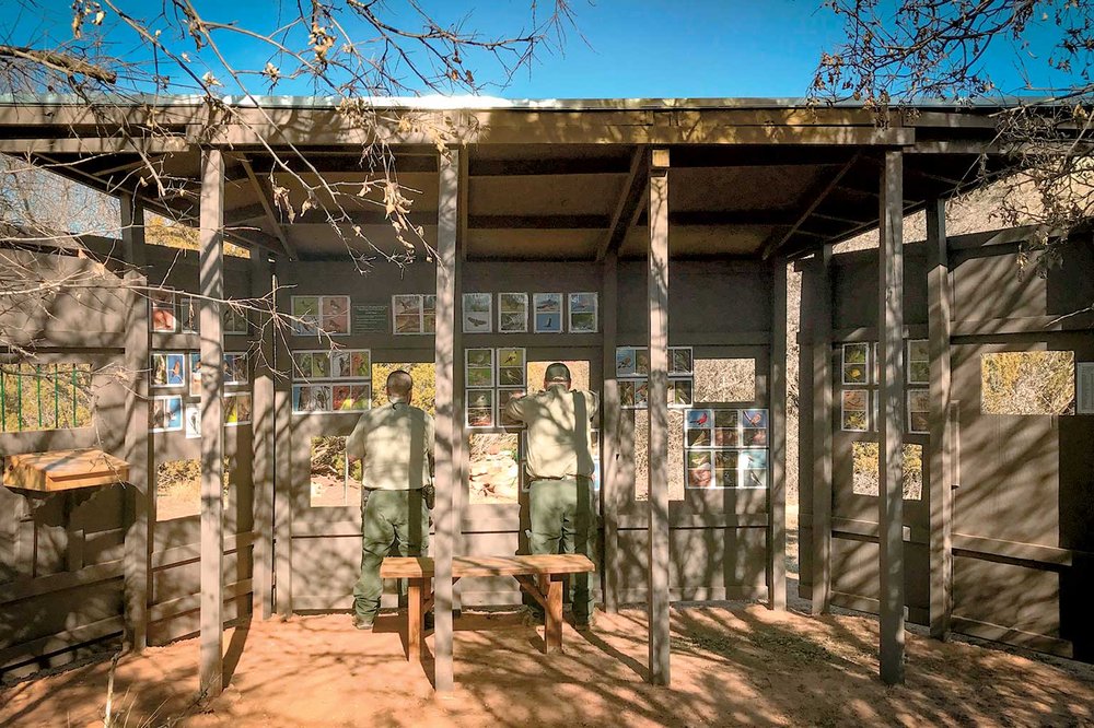 two people looking out the palo duro canyon state park bird blind