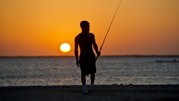 Padre Island Beach - man fishing at sunrise