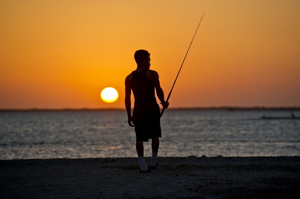 Padre Island Beach - man fishing at sunrise